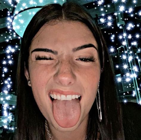 It's a drop in the ocean as far as her TikTok stardom is concerned she still has a following of over 98 million but it's the mean comments that she's struggling with, D'Amelio said in a tearful livestream Thursday. . Charli damelio tongue out